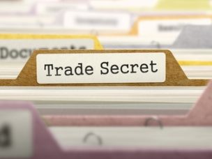 A folder labeled "Trade Secret" while every other label is blurred out.