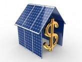miniature solar panel house with gold money sign in the middle