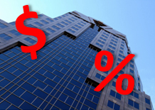 skyscraper building with blue sky and a red money sign and red percent sign