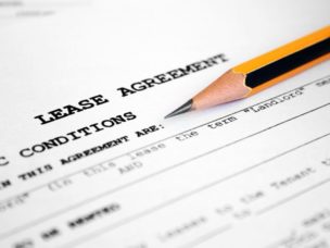 lease agreement and black and yellow pencil