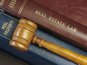 real estate law books and gavel