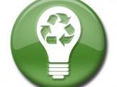 a green circle with a white lightbulb in the middle and recycling sign in the bulb