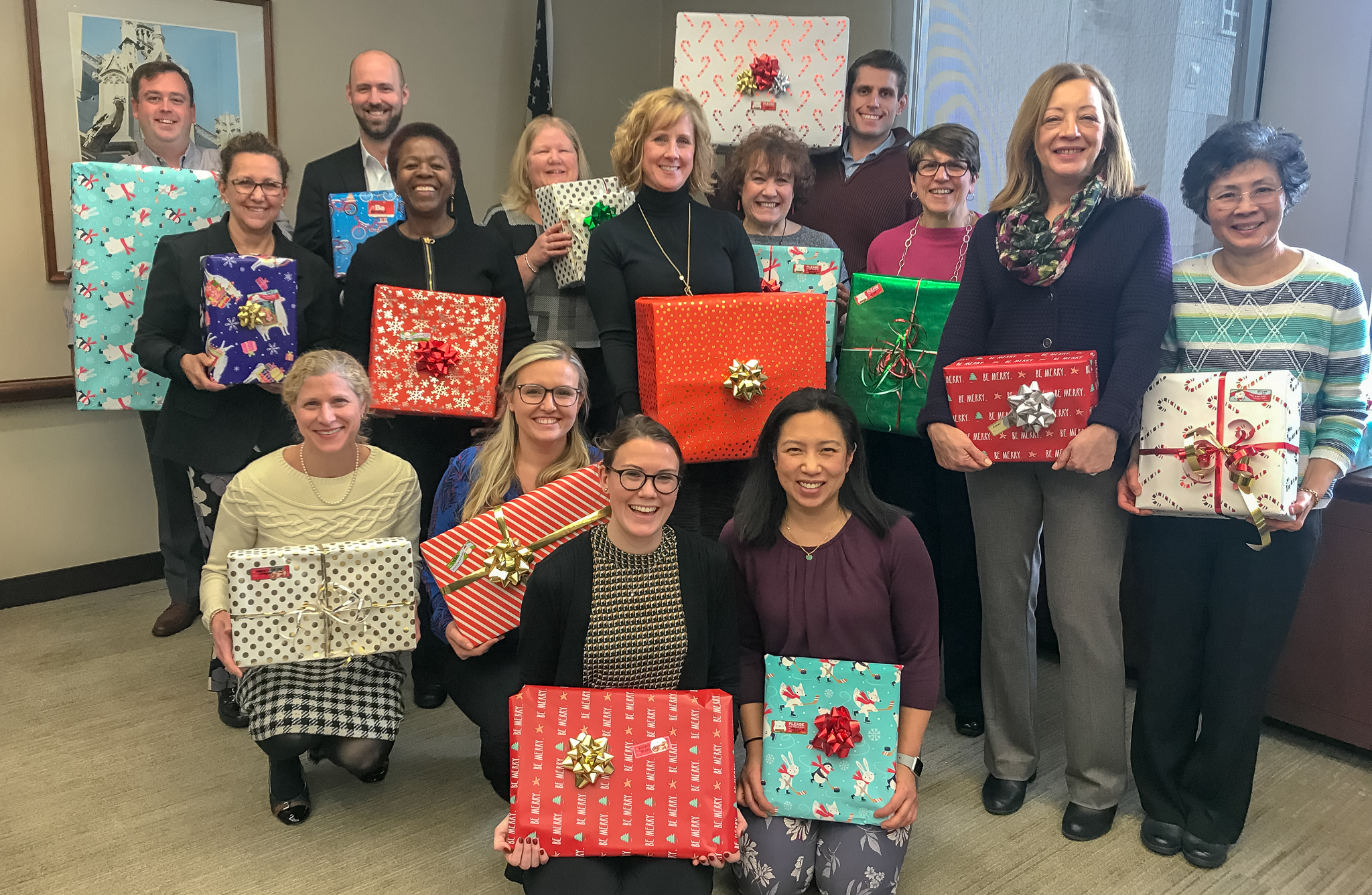 Shein and Lodgen holding wrapped gifts for VRLC