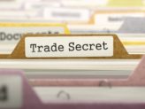 A folder labeled "Trade Secret" while every other label is blurred out.
