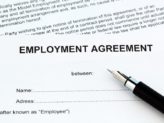 Document reading "Employment Agreement" with a pen on top of it