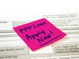 pink sticky note on a loan application reminding reader to apply for PPP Loan